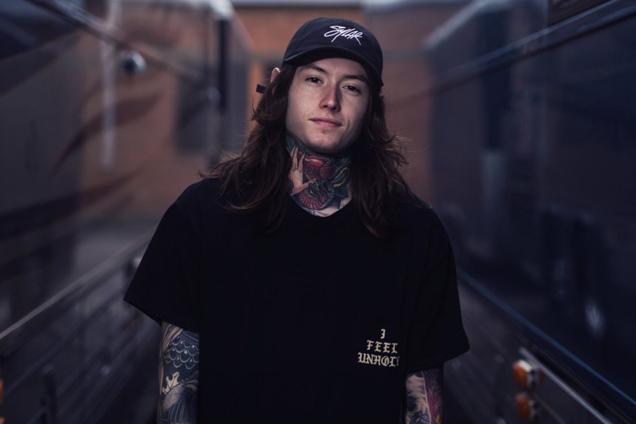 noah sebastian of bad omens photoshoot by bryan kirks wearing black tshirt and cap 920x613 1 - Santan Dave Store